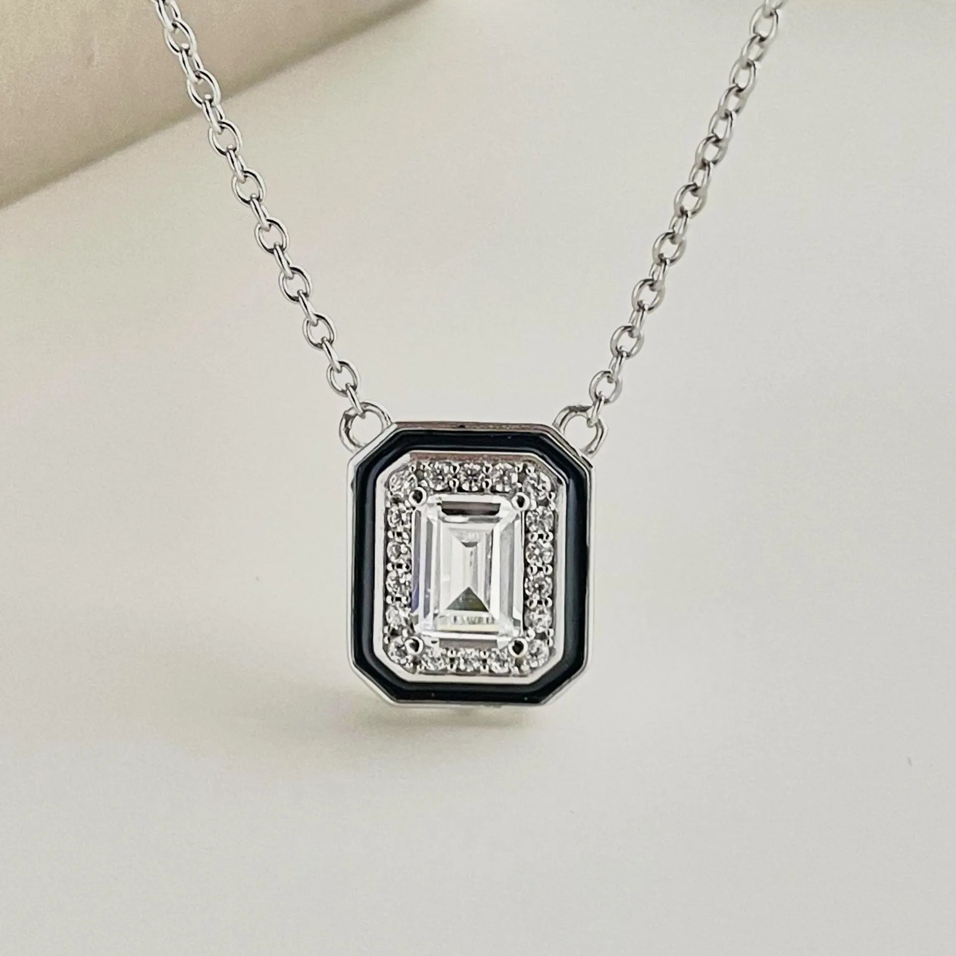Women's 925 silver rectangular zircon fashion necklace with blue stone pendant on white background