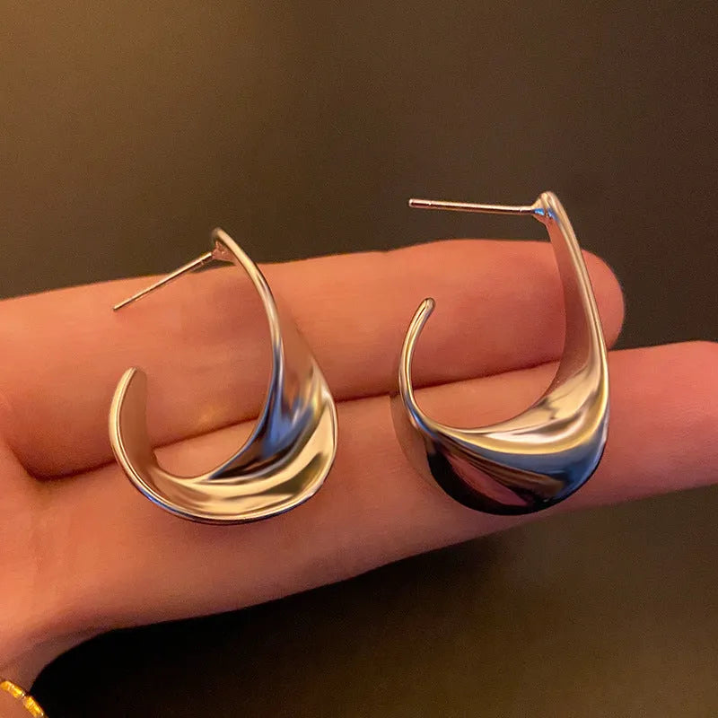 Metal geometric earrings with twisted design in gold or silver electroplated finish
