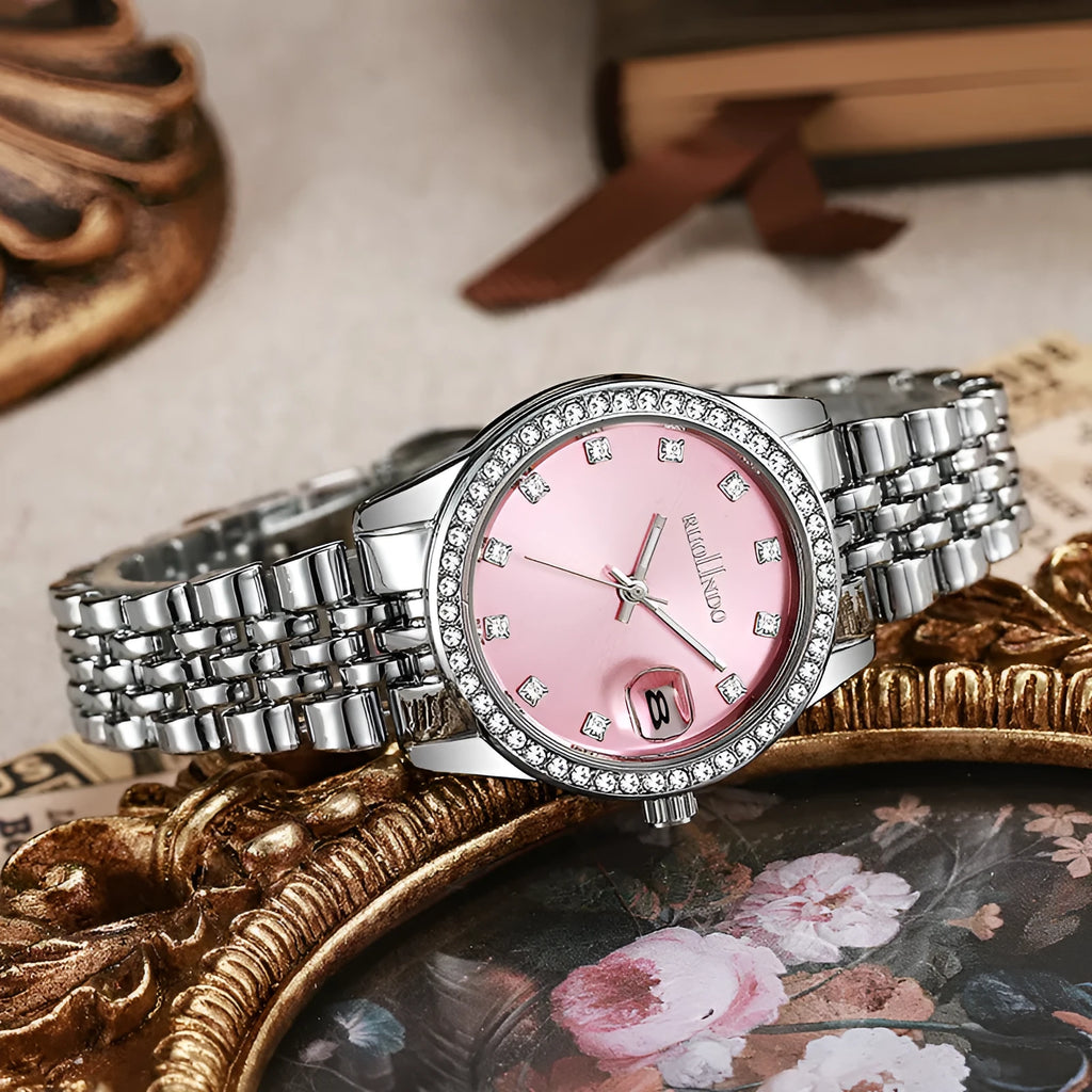 Women's silver alloy quartz calendar watch with circular dial and stainless steel folding buckle on wrist.