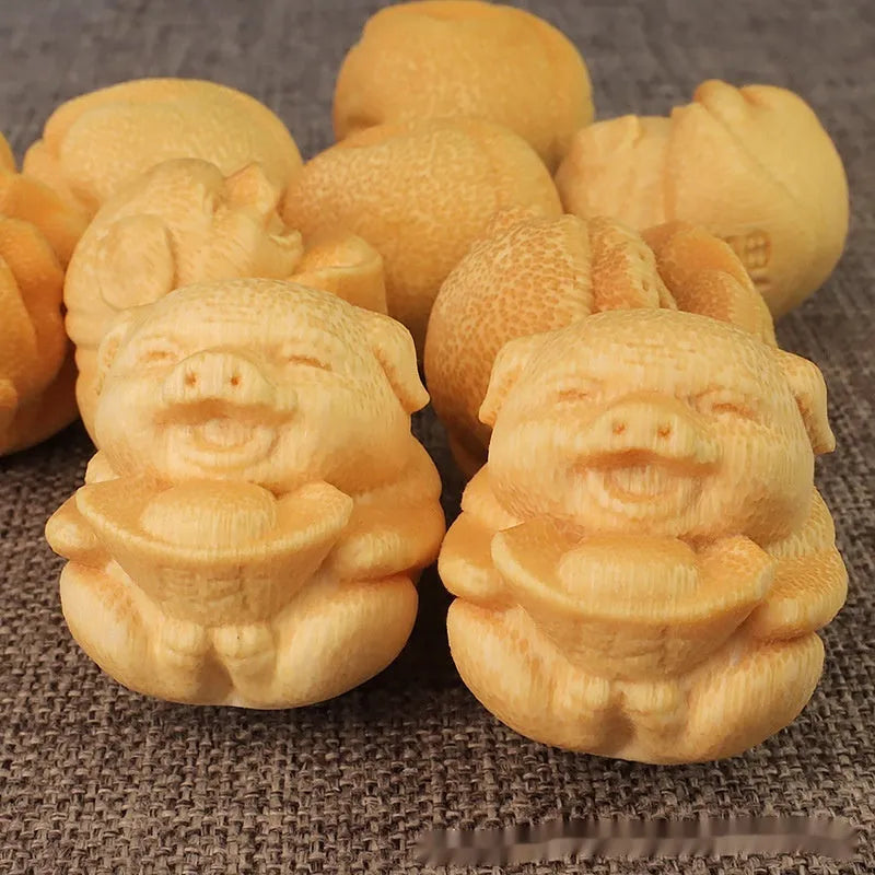 Solid bamboo carving ornament showing ingot pig design with 4cm height