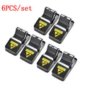 Six black plastic snapping mouse traps showing dimensions and smooth surface