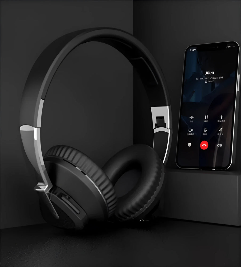 Wireless Bluetooth headset in black colour showing ear cushions with AUX audio jack and control buttons