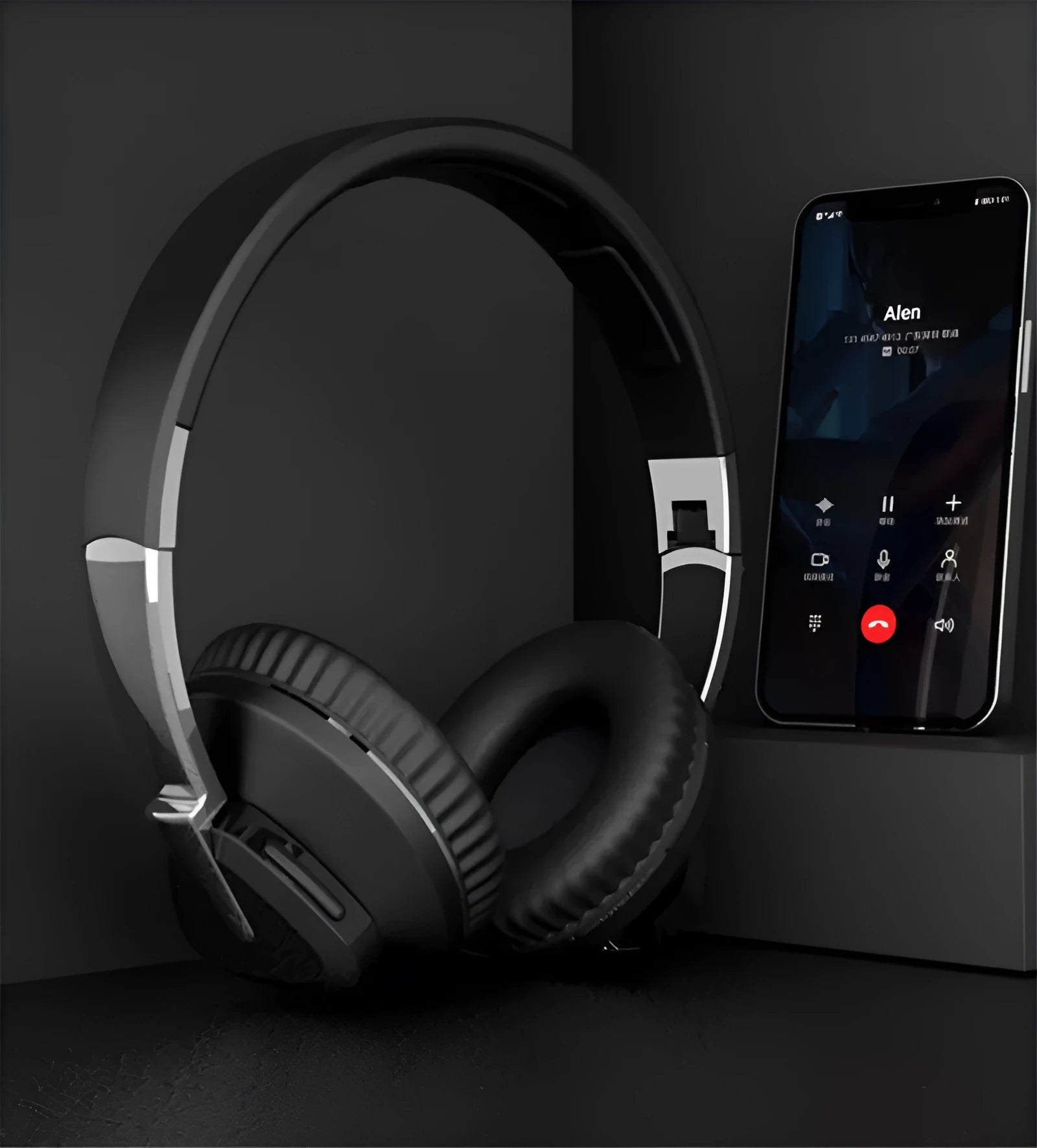 Wireless Bluetooth headset in black colour showing ear cushions with AUX audio jack and control buttons