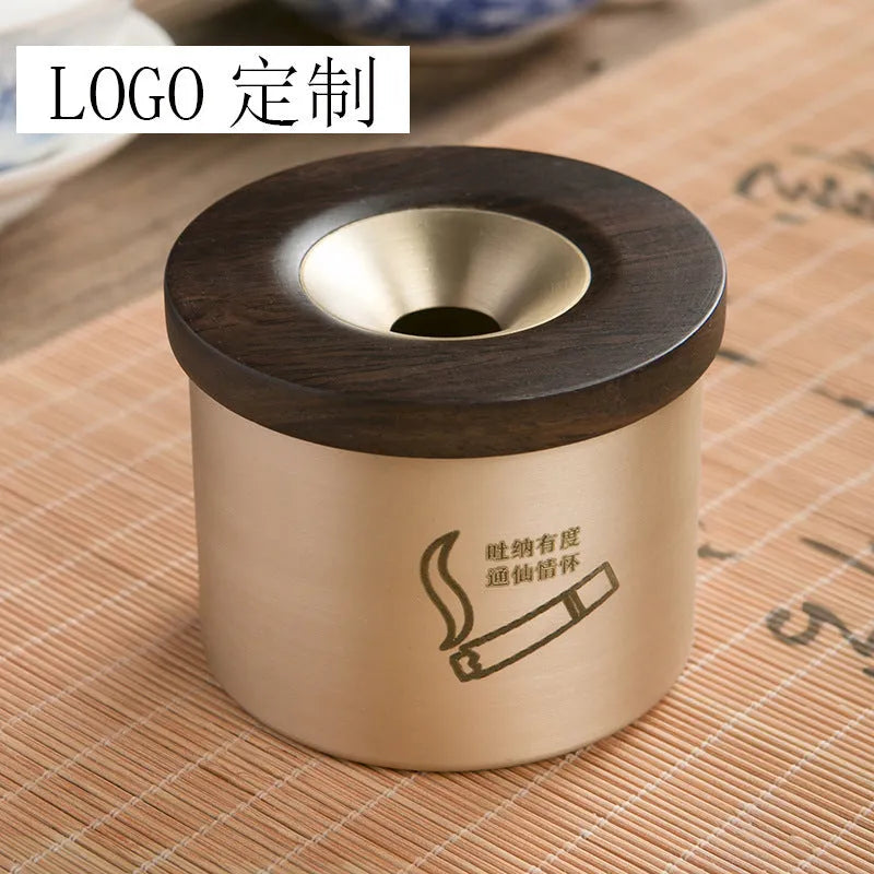 Retro brass-coloured copper ashtray with a wooden lid featuring a central hole