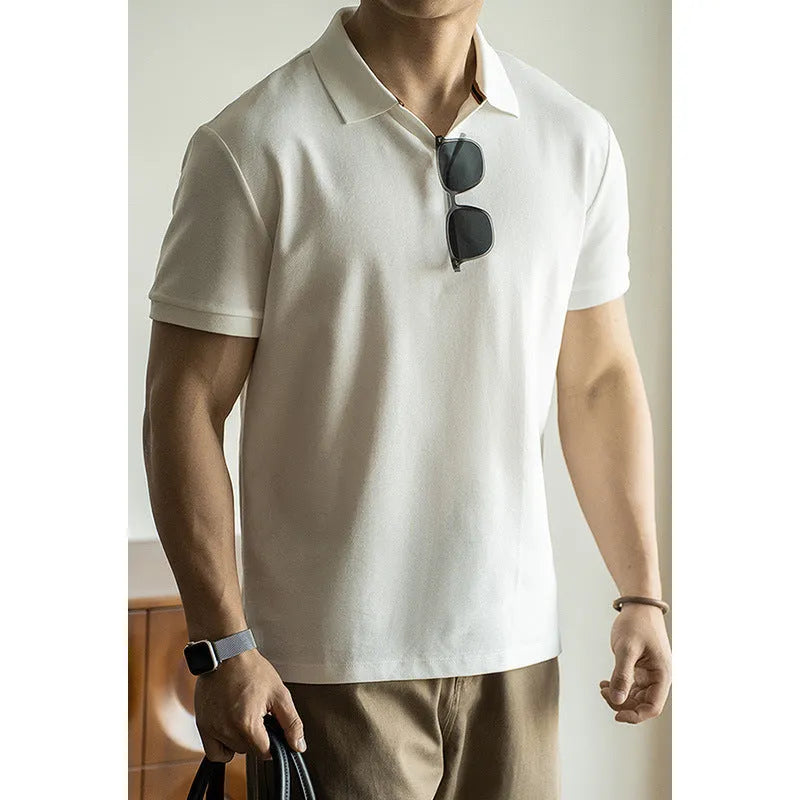 American-style short-sleeved polo shirt in a blue cotton-polyester blend on a hanger.