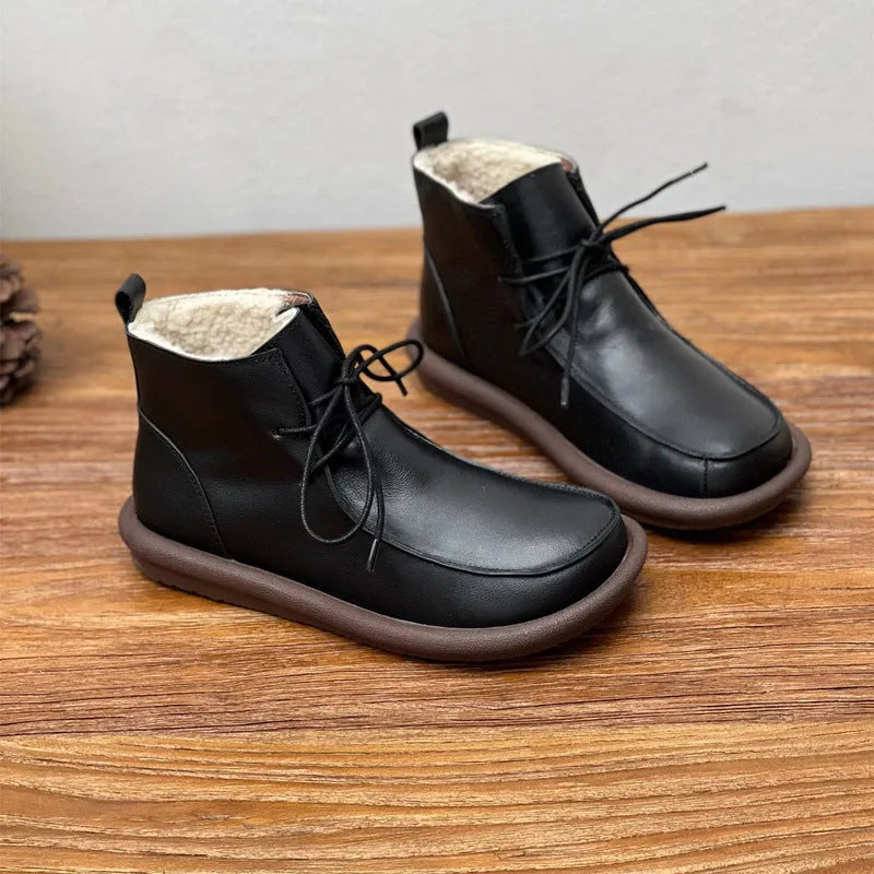 Women's extra-thick velvet warm cowhide boots in black with flat heel and round toe shape
