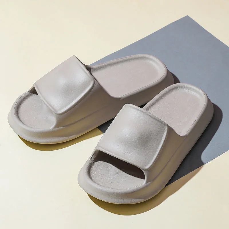 A pair of thick-soled EVA foam flip-flop slippers in a choice of seven colours on a plain background.