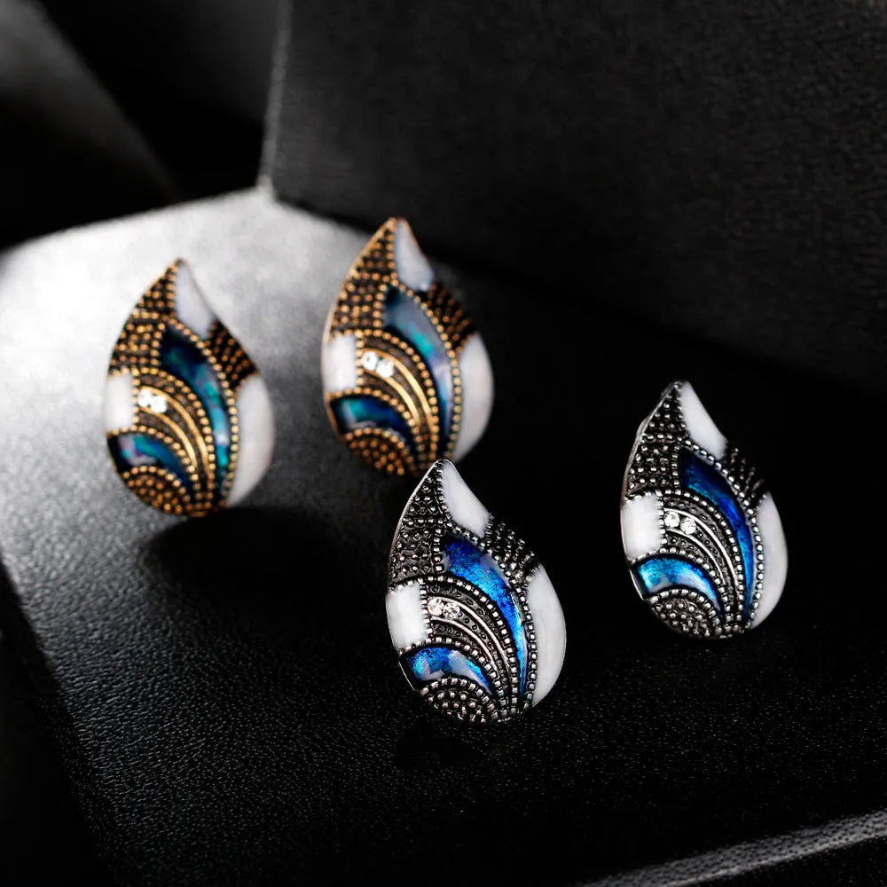 Water drop jewelry set including necklace, earrings and ring in gold or silver zinc alloy finish.