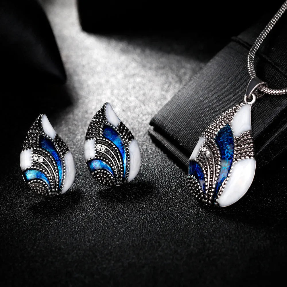 Water drop jewelry set including necklace, earrings and ring in gold or silver zinc alloy finish.