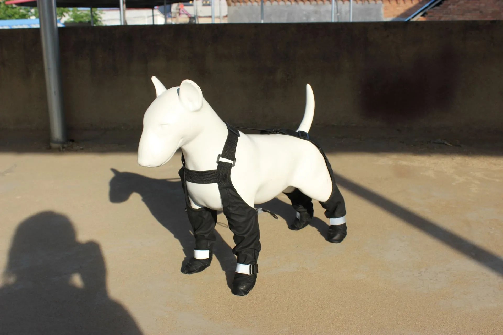 Black waterproof non-slip dog paw protectors showing size range XS to XXL