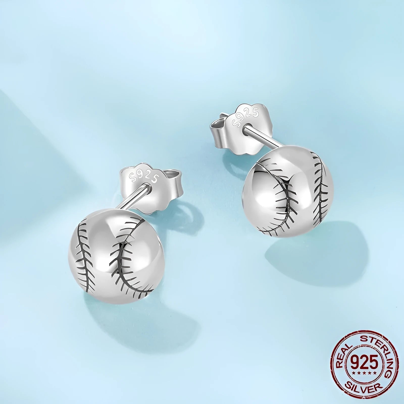 S925 sterling silver baseball stud earrings with polished finish on a plain background