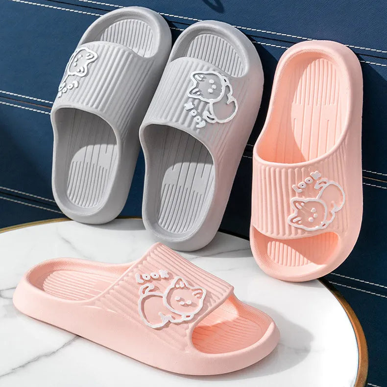 Women's green cat slippers with thick EVA platform sole on a wooden floor