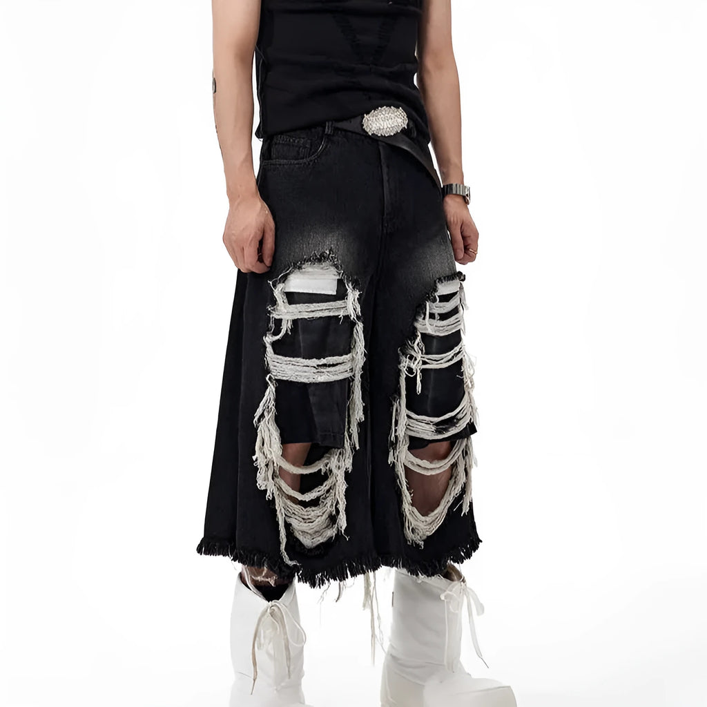 Black cropped wide leg jeans with mid-high waist and ripped patch detail on a loose fit.
