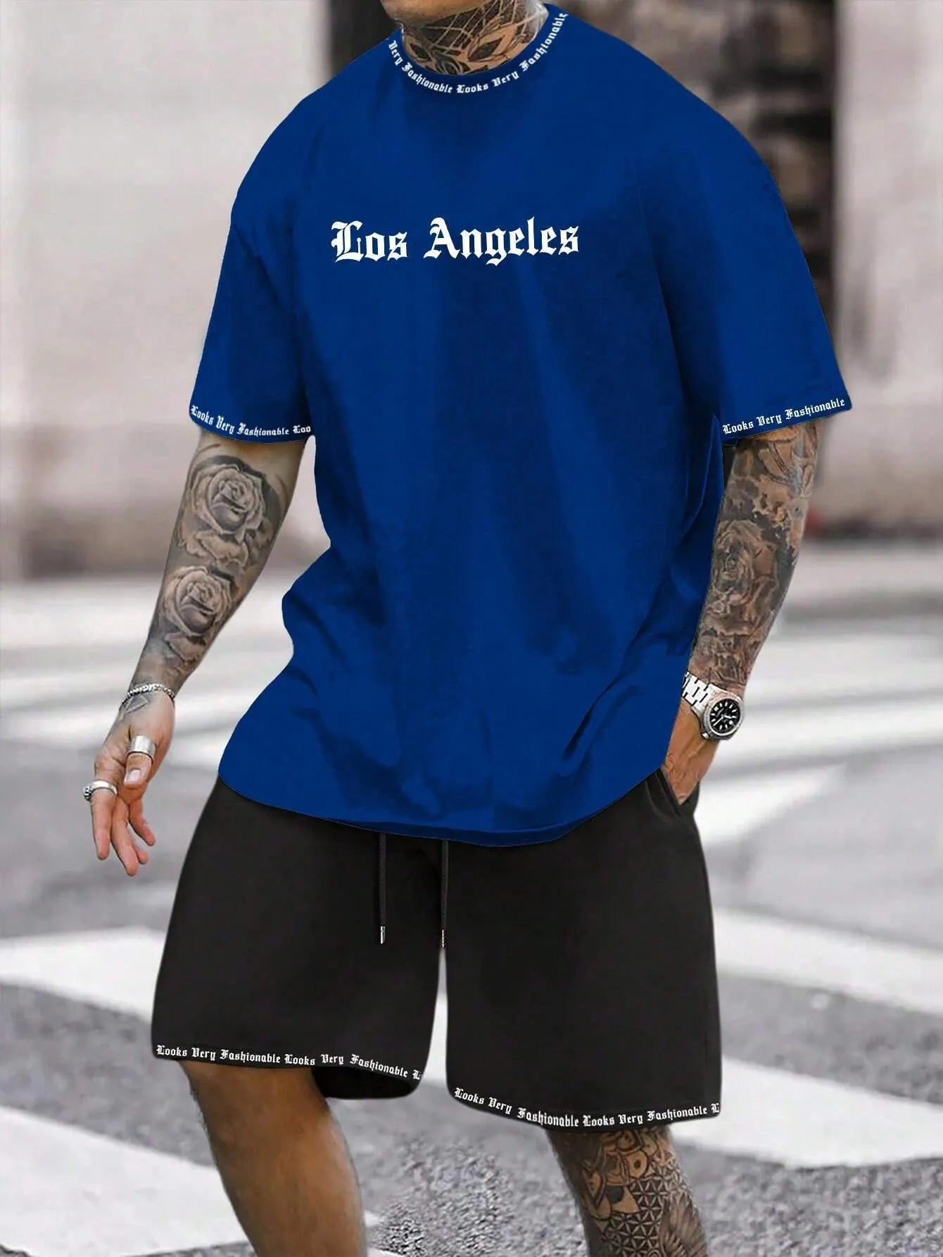 Sports style short-sleeved top and matching shorts set laid flat, showing thin polyester blend fabric.