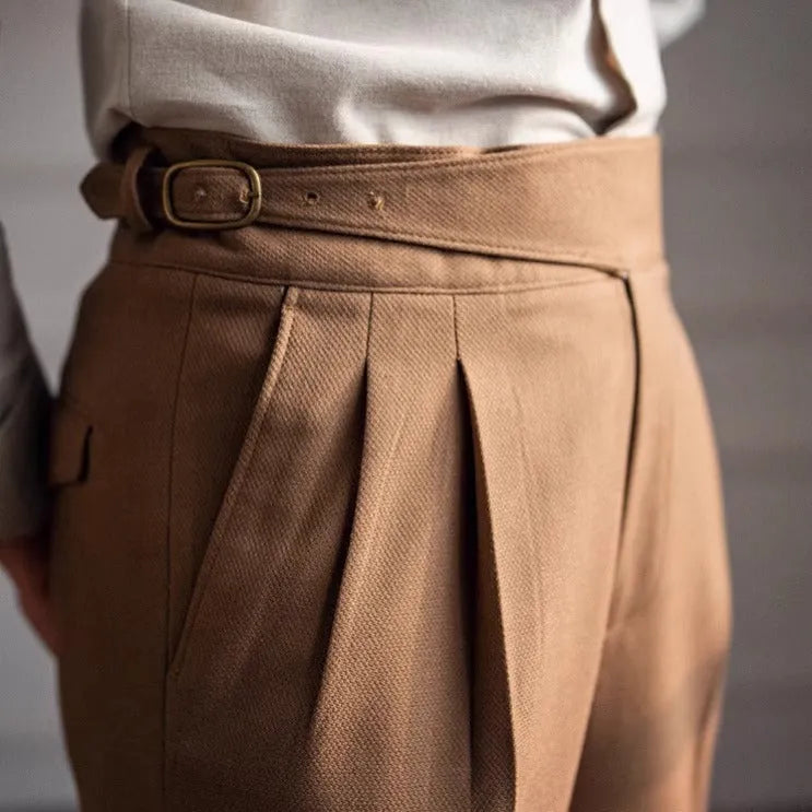 Man wearing high waist straight leg casual trousers in black polyester fabric.