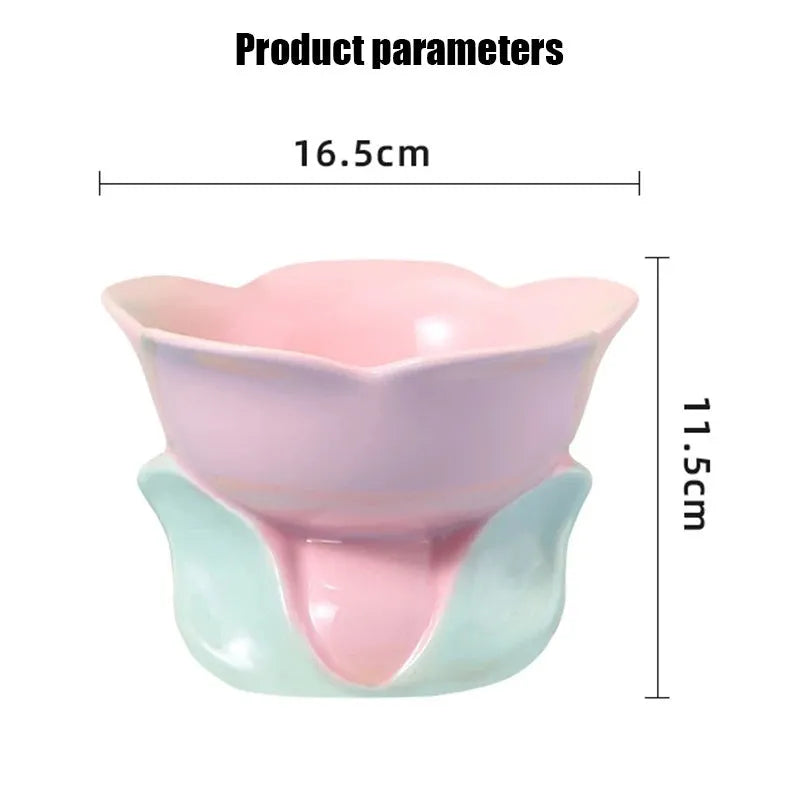 Blue ceramic elevated pet feeding bowl with floral pattern and non-slip base