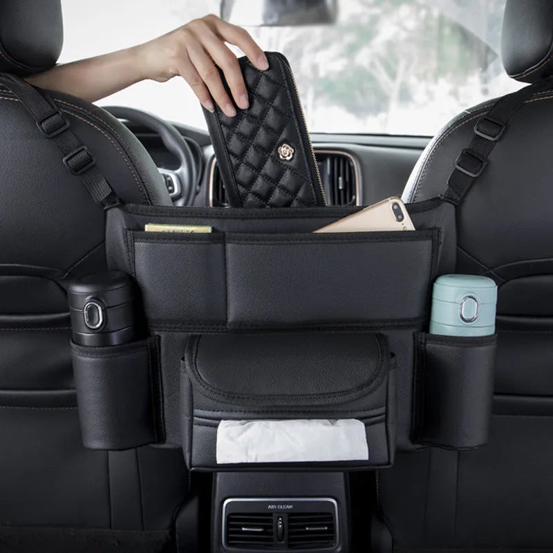 Black leather car seat hanging storage bag with tissue box between car armrests