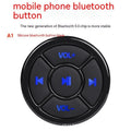 36mm black silicone Bluetooth remote control clipped to a car steering wheel for hands-free phone operation