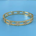 Women's hollow bracelet with four-leaf clover design and zircon stones in gold or silver finish