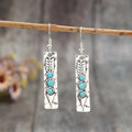 Women's silver geometric earrings with turquoise inlay detailing on long strip alloy design