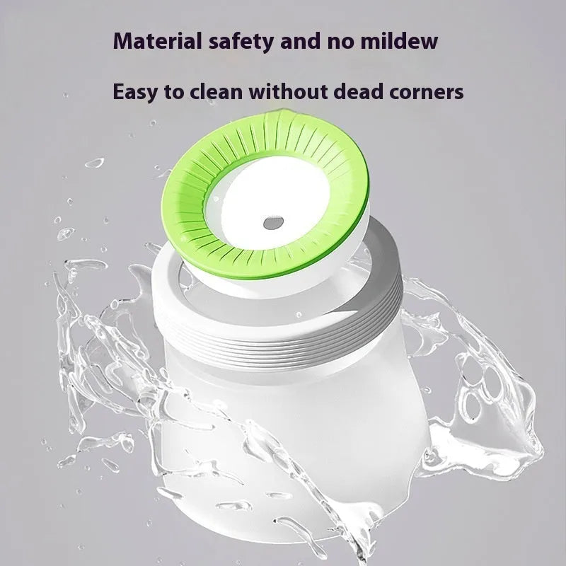 Green elevated pet water bowl with suspension stand next to a drinking cat