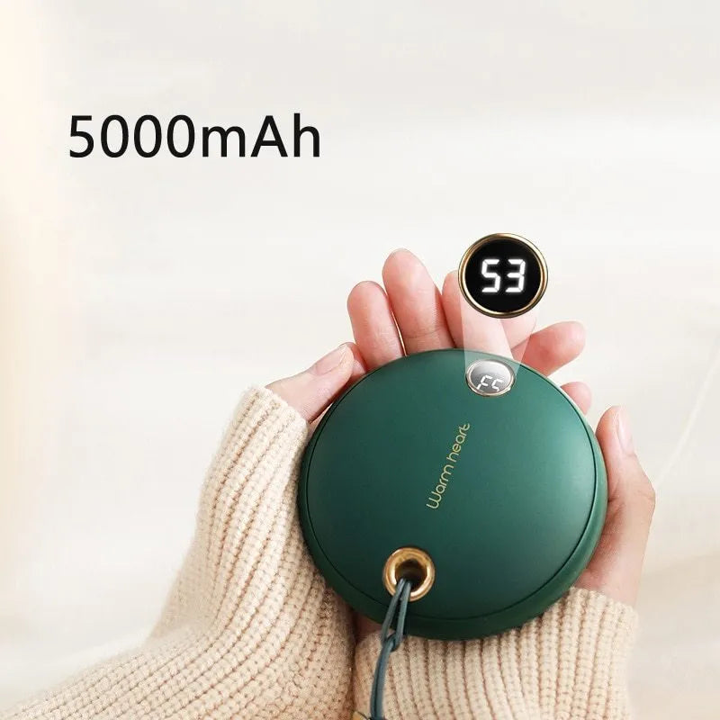 Green portable power bank with digital display and integrated hand warmer heater for phone charging