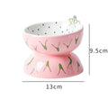 Orange patterned ceramic raised cat bowl with wide tilted dish on non-slip base.