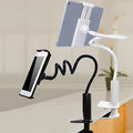 Black flexible mount holder with bendy arm and suction base holding a mobile phone