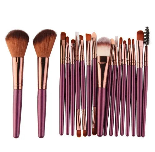MAANGE 18 piece makeup and brush set with fan-shaped brushes and multiple style options laid out.