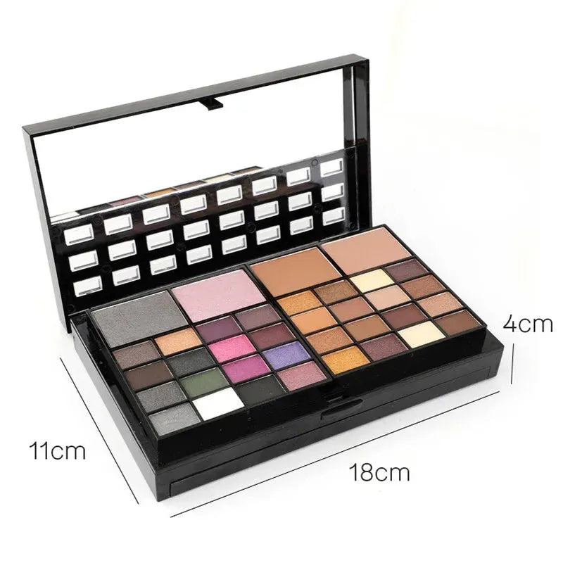 Open 74-colour makeup palette showing four layers of eyeshadow, lip gloss, blush, and contour powders with included brushes.