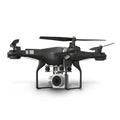 Black alloy HD aerial photography drone with remote control handle in flight.