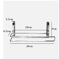 Silver stainless steel paper towel rack hanging on a cabinet door.