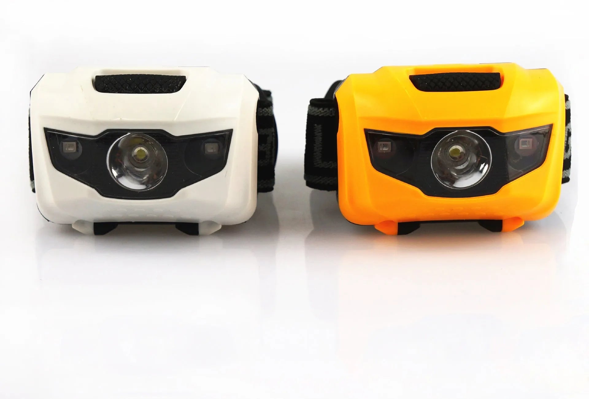 Black cat eye design LED headlamp head torch with white and red lights on an adjustable strap.