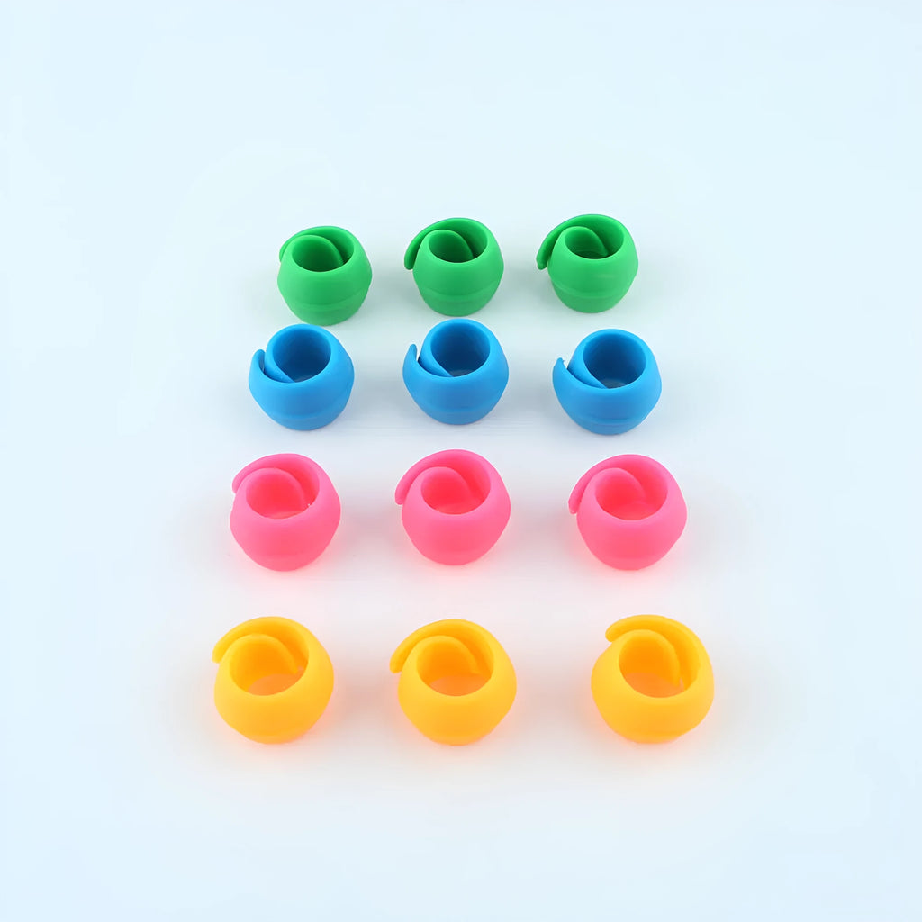 14 silicone sewing spool fixed clips in red, blue, orange, and green on a white background
