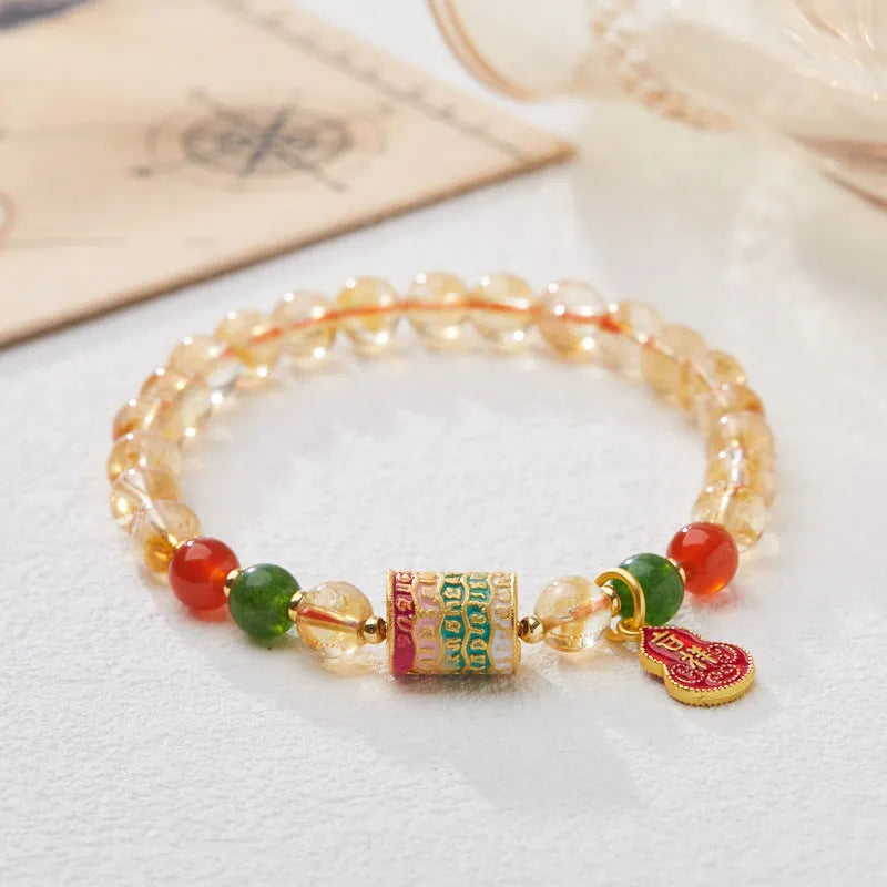 Hand-woven citrine five sutra bracelet with 6mm crystal beads showing geometric patterns