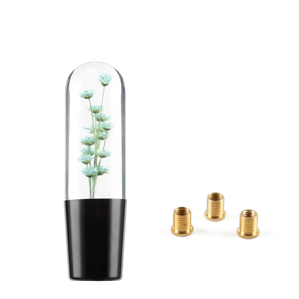 JDM crystal car gear knob with flower-in-water design, 15cm long, shown with three fitting adapters