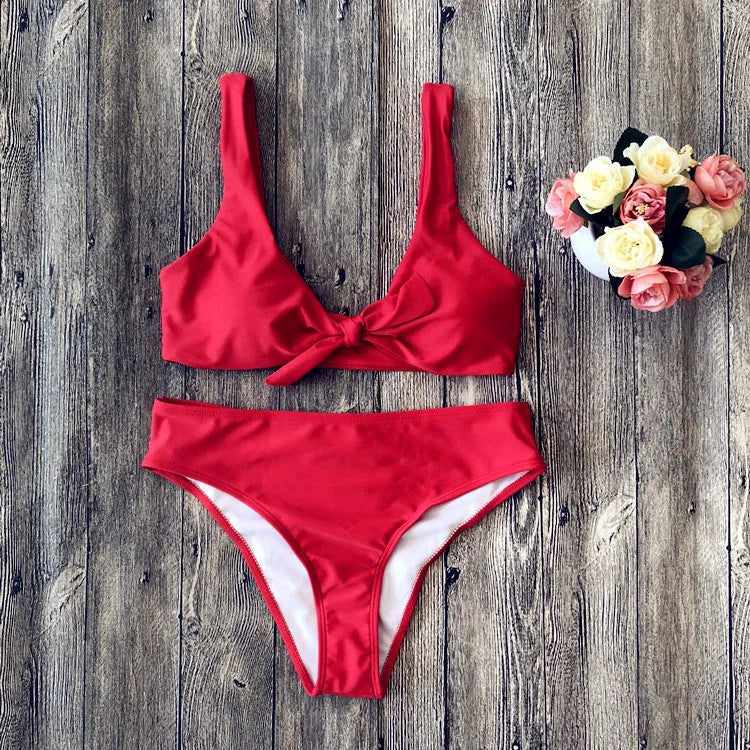 Ladies' polyester bikini set in solid red colour, showing bra top and briefs.