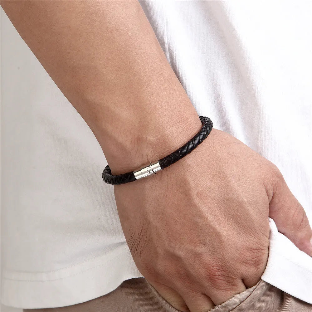Titanium steel geometric wire bracelet with a magnetic clasp and charm socket.