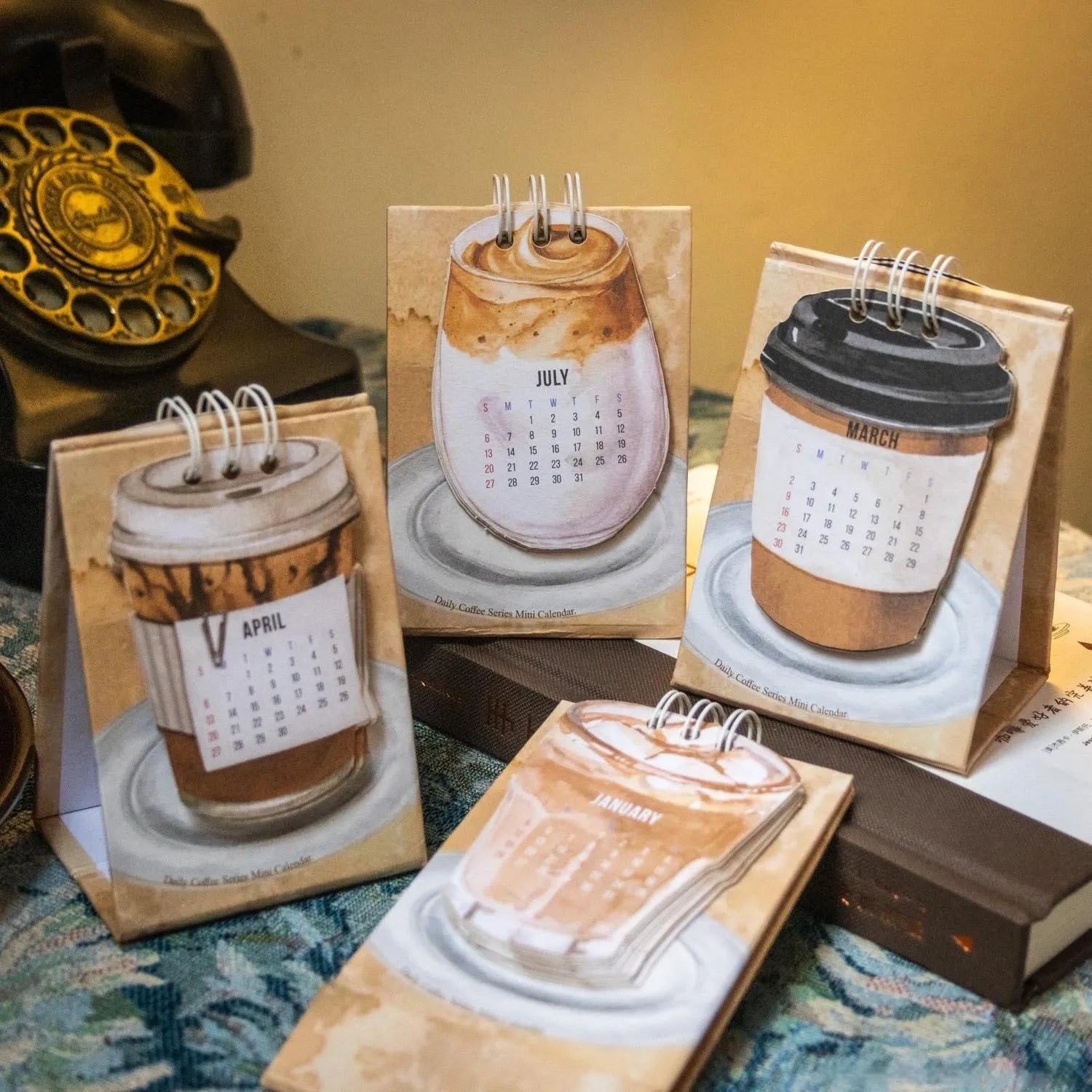 Coffee-themed 2025 mini desk calendar showing four simple modern design options