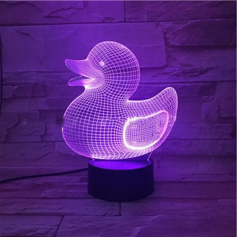 3D cartoon yellow duck LED night light on a table, showing multiple colour options with remote control.