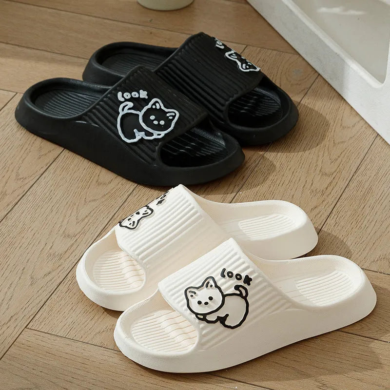 Women's green cat slippers with thick EVA platform sole on a wooden floor