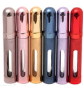 12ml aluminium portable perfume bottle in bullet shape with glass liner, shown in six colour options.
