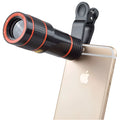 12X magnification phone telescope lens with universal mounting clip and cleaning cloth on a white background.