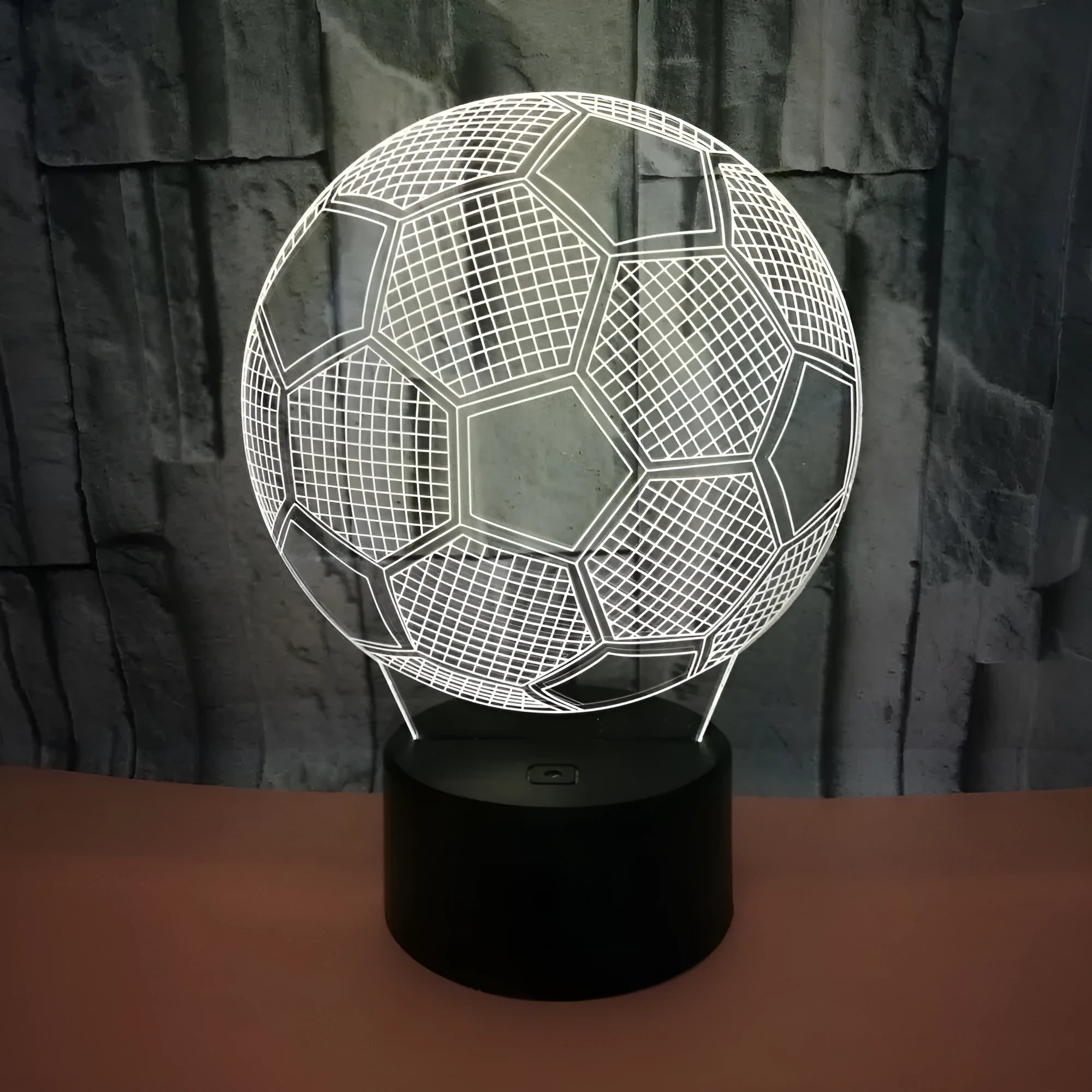 3D football-shaped night light with colourful LED illumination on an ABS base.