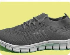 Breathable women's casual flat shoes in flying knit mesh with front lace tie.