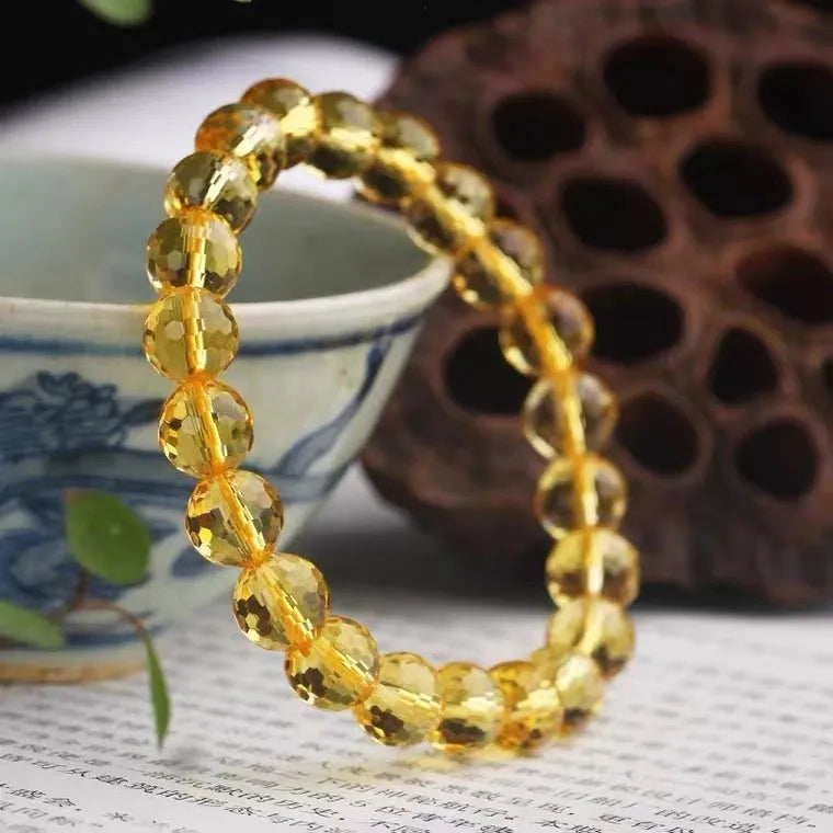 Close-up of a 128-facet cut crystal ametrine bracelet with detailed bead modelling on a wrist.
