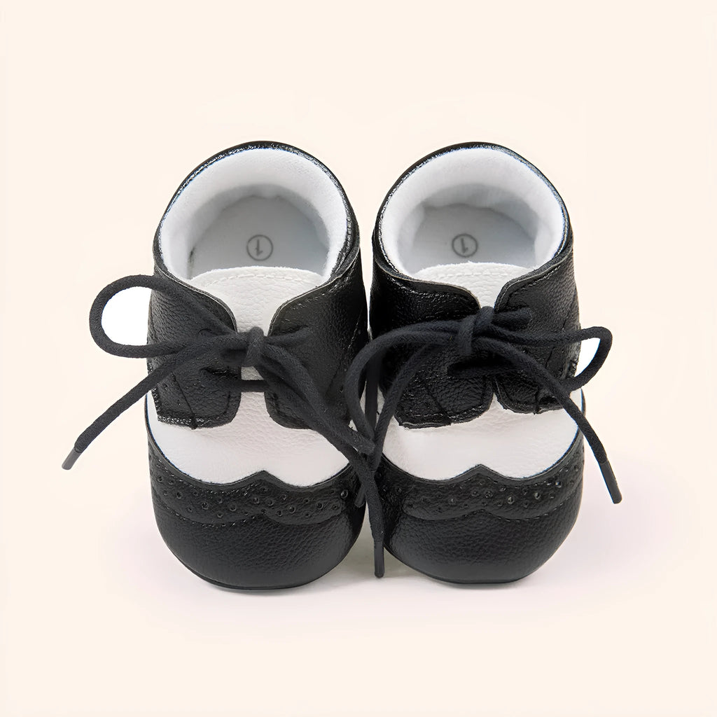 Vintage style baby walking shoes with soft soles and synthetic leather uppers in multiple colours