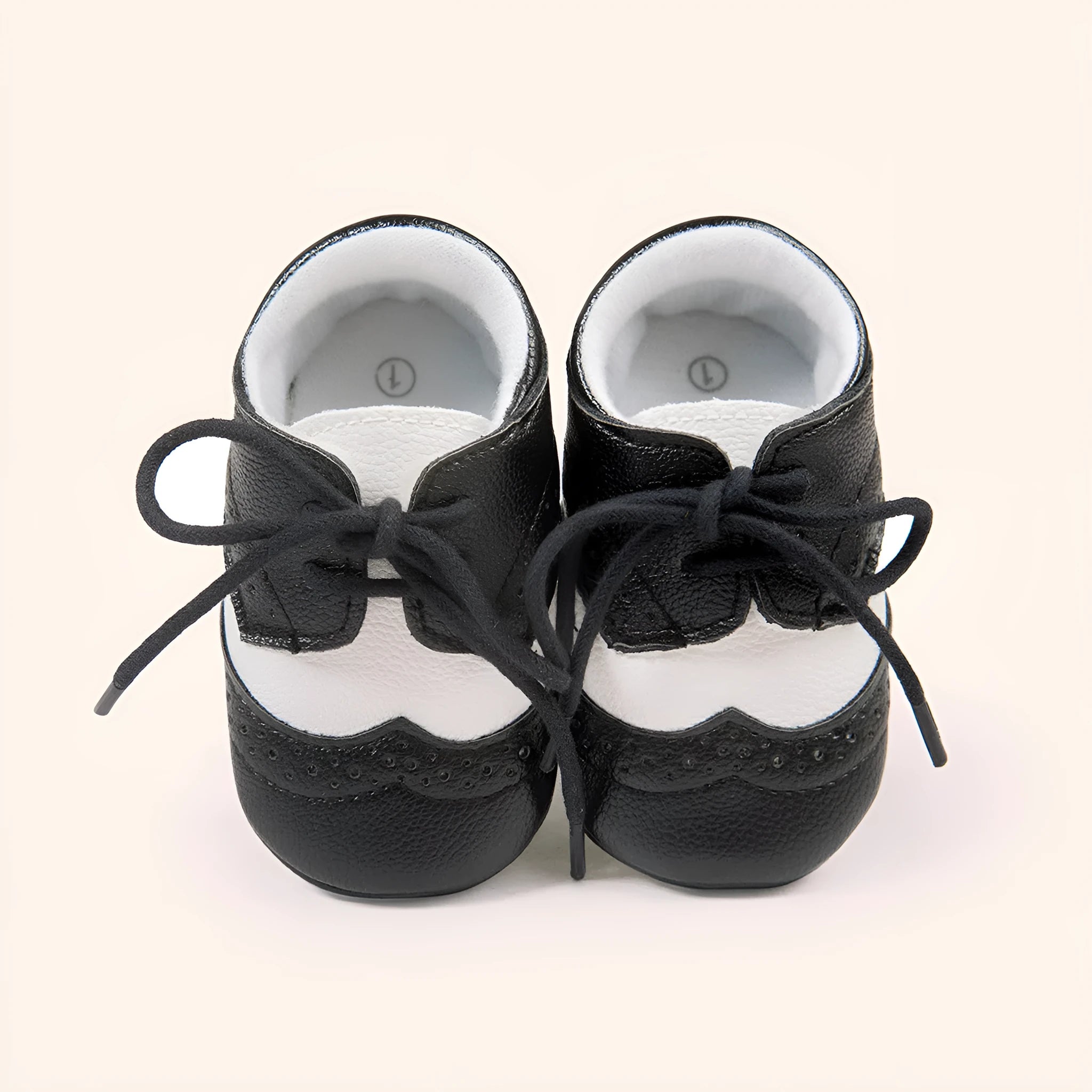 Vintage style baby walking shoes with soft soles and synthetic leather uppers in multiple colours