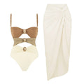 Women's solid-colour one-piece swimsuit with detachable skirt and gold button details in assorted colours.