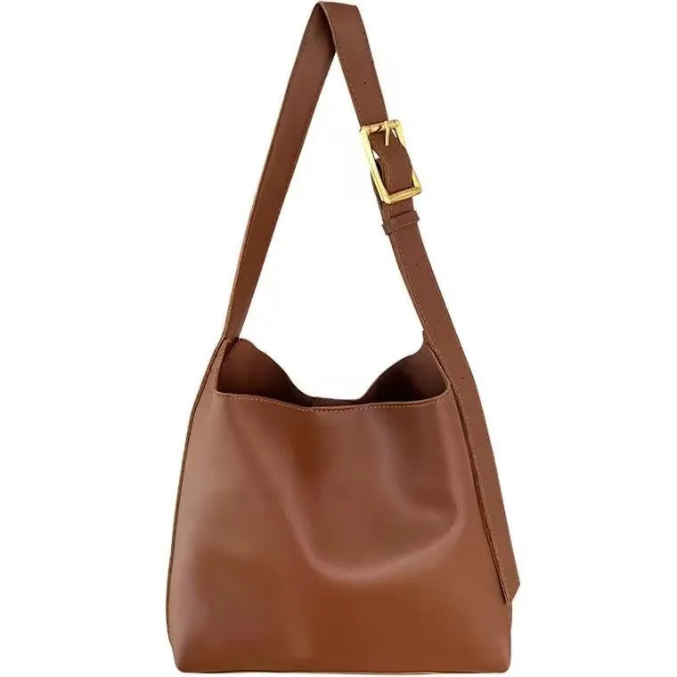 Women's soft PU shoulder bag with swing threads decoration in black or brown colour